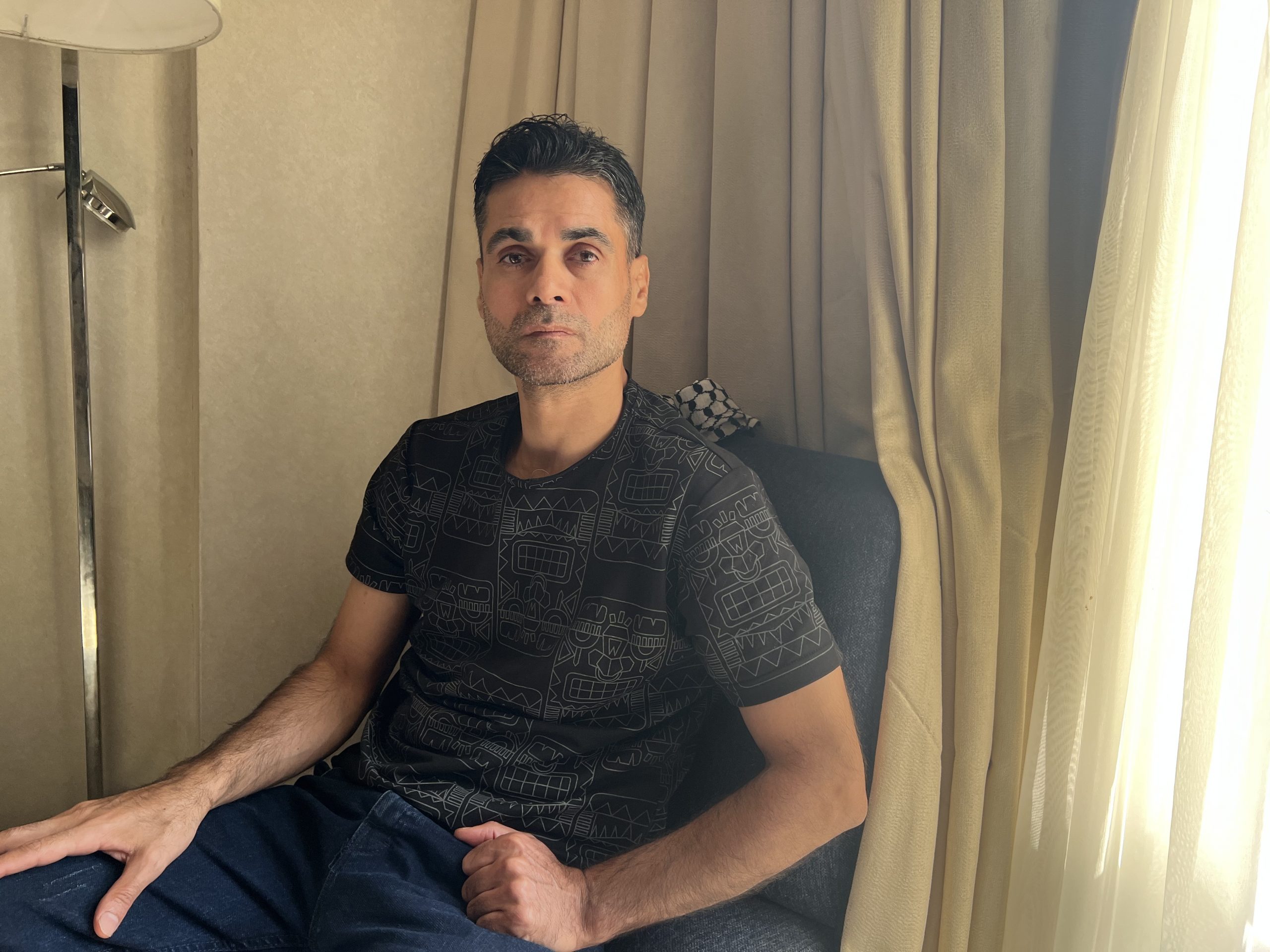 Mahmoud Al-Arda sits in a hotel room in Cairo, Egypt on Oct. 30, 2025. Al-Arida was freed after 32 years in Israeli prison as part of the prisoner exchange with Hamas