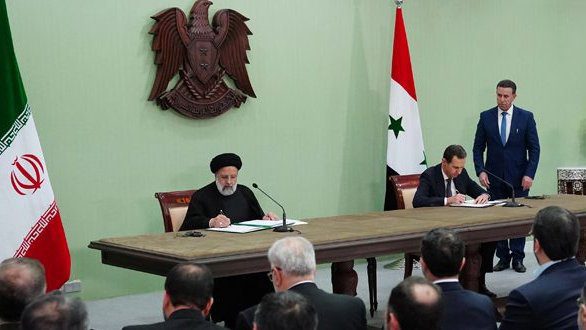 Iran and Syria call for end of Western economic domination, withdrawal of all foreign troops from the region