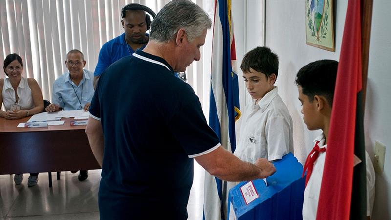 Cuban president votes during a referendum on the new constitution