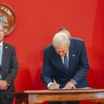 José Antonio Kast signs document