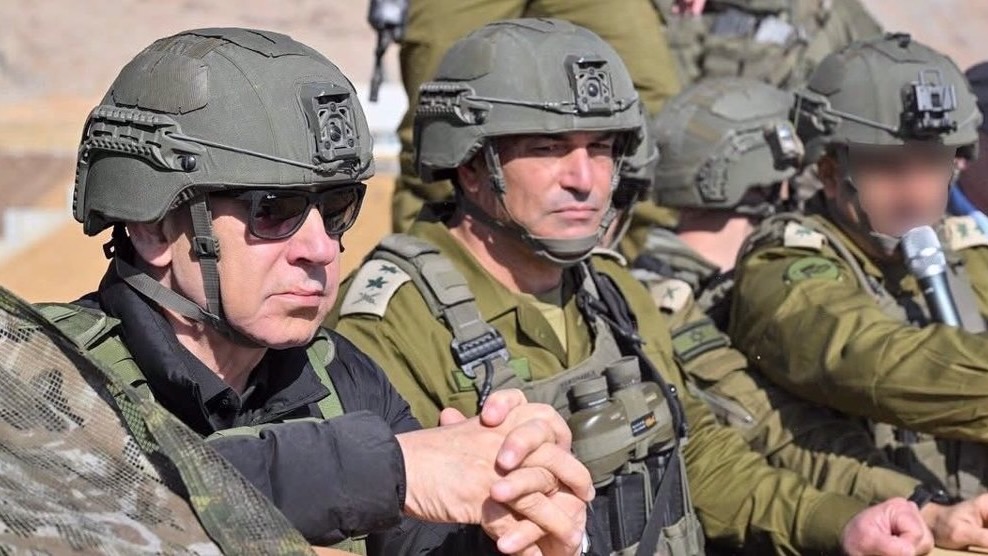 Israeli Prime Minister Benjamin Netanyahu (L) alongside senior Israeli officials tour the buffer zone on the Syrian side of the Israeli-occupied Golan Heights on November 19, 2025.