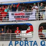 boat parade with 200 vessels navigating the waters of the Guajará Bay