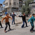 Children breakdancing outside a dance studio in Gaza