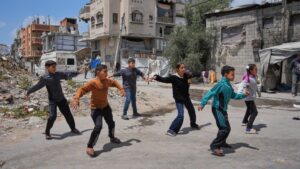 Children breakdancing outside a dance studio in Gaza