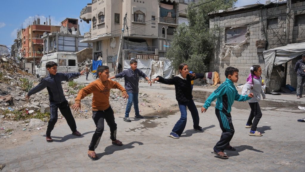 Children breakdancing outside a dance studio in Gaza