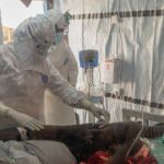 Medical personnel care for Ebola patient in quarantine in DRC