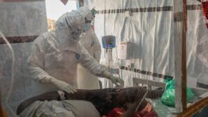 Medical personnel care for Ebola patient in quarantine in DRC