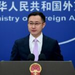 Foreign Ministry Spokesperson Lin Jian at podium in front of blue background