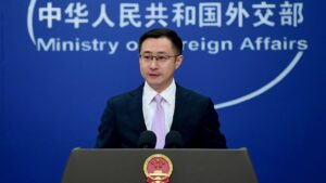 Foreign Ministry Spokesperson Lin Jian at podium in front of blue background