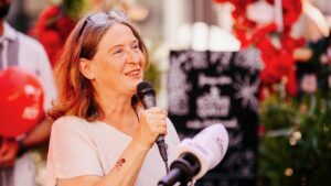 Elke Kahr from the KPO in Graz, Austria speaks into microphone after election victory