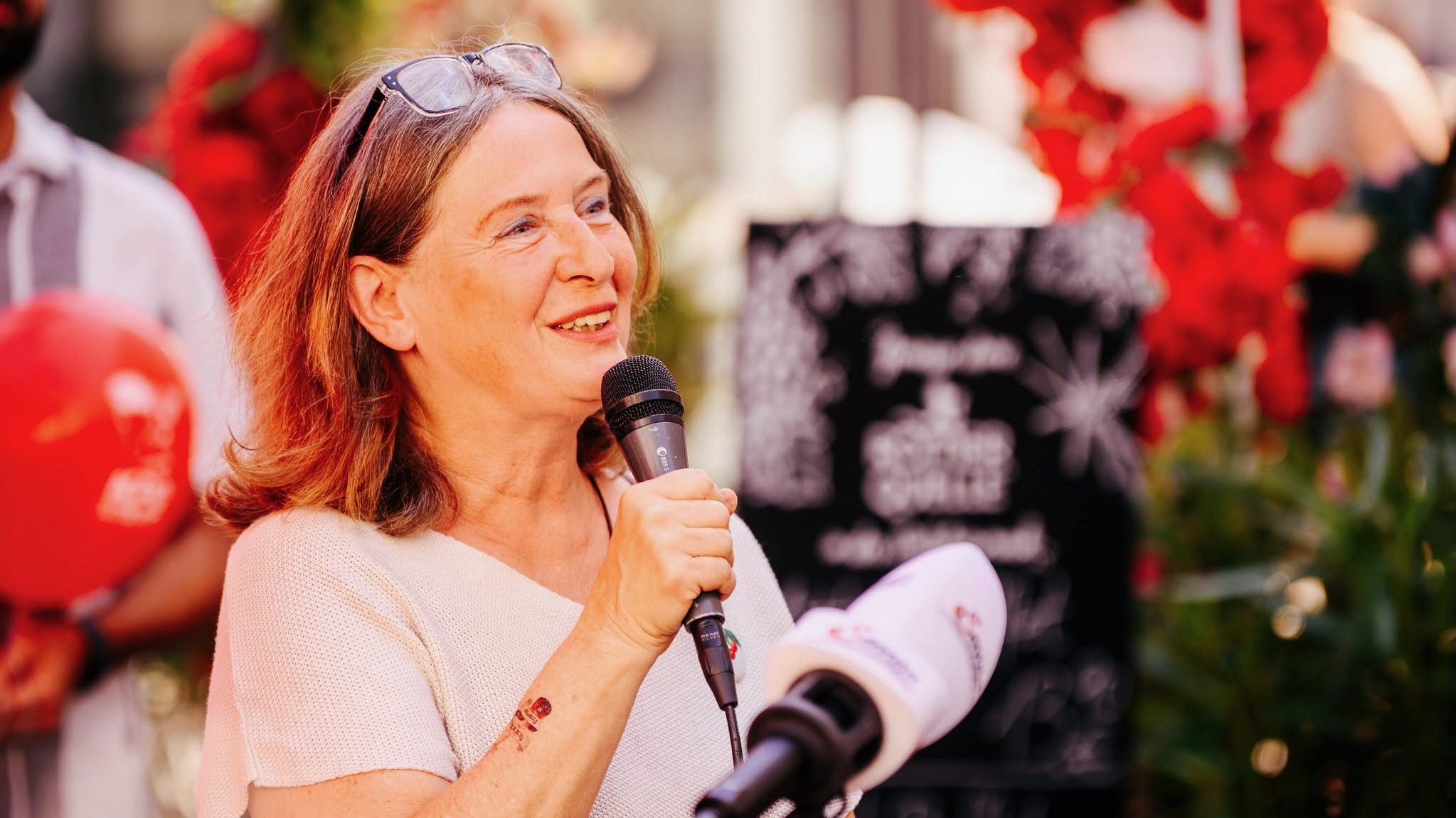 Elke Kahr from the KPO in Graz, Austria speaks into microphone after election victory