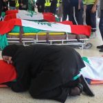 Lebanese woman hugs family member killed by Israeli airstrikes