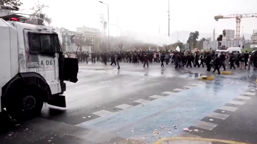 Water cannon blasts group of students
