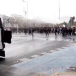 Water cannon blasts group of students