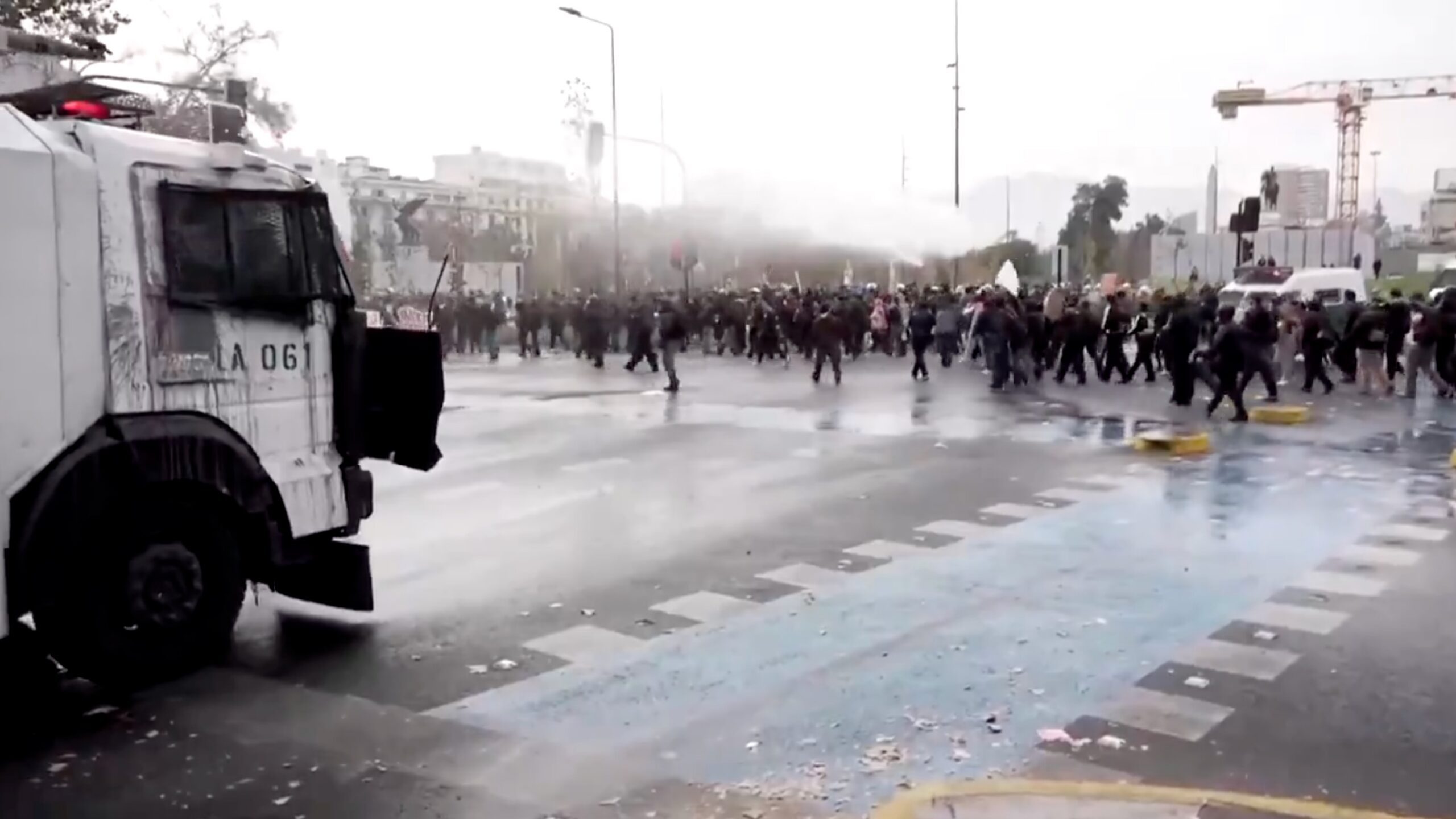 Water cannon blasts group of students