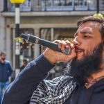 Umer Khalid speaking into a mic