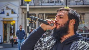 Umer Khalid speaking into a mic