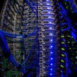 Blue wires connecting to servers with blue and green lights