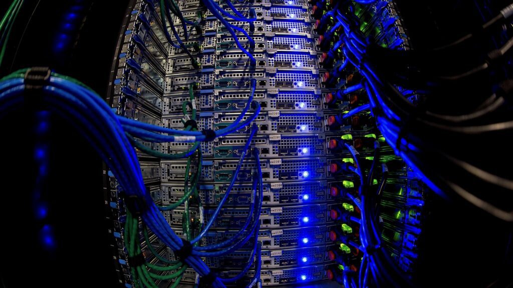 Wikimedia_Foundation_Servers_2015-63 - BT News Blue wires connecting to servers with blue and green lights