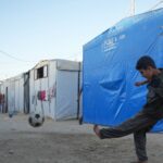 Youth play soccer in Gaza