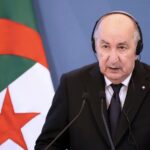 Algeria's President Abdelmadjid Tebboune speaking at a podium