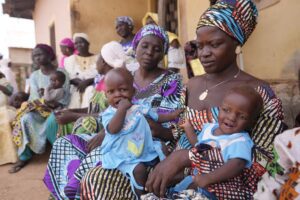 Dorcas Simon 38-year-old plays with her twin daughters