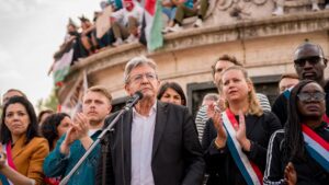 La France Insoumises Jean-Luc Mélenchon speaks in front of a crowd