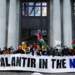 Activists raise banner that reads "No Palantir in the NHS!"
