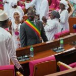 Senegalese President of the National Assembly Ousmane Sonko applauded by parliament members in white