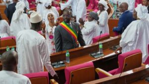 Senegalese President of the National Assembly Ousmane Sonko applauded by parliament members in white