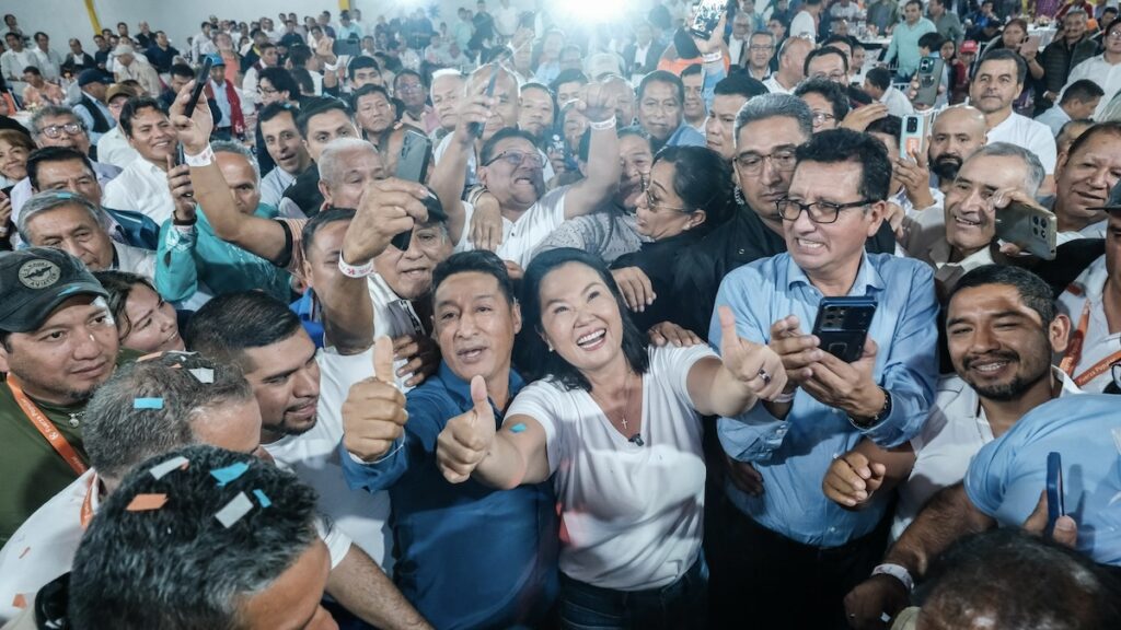 Keiko Fujimori surrounded by supporters