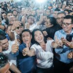 Keiko Fujimori surrounded by supporters
